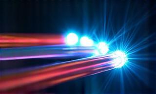 Close-up view of vibrant fibre optic cables representing high-speed internet.